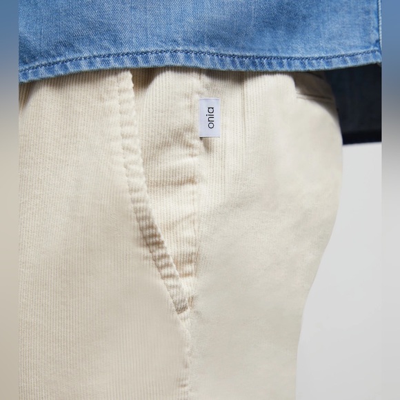 The onia corduroy jogger has flat front with zipper and drawcord waist. In Swan - Picture 4 of 4